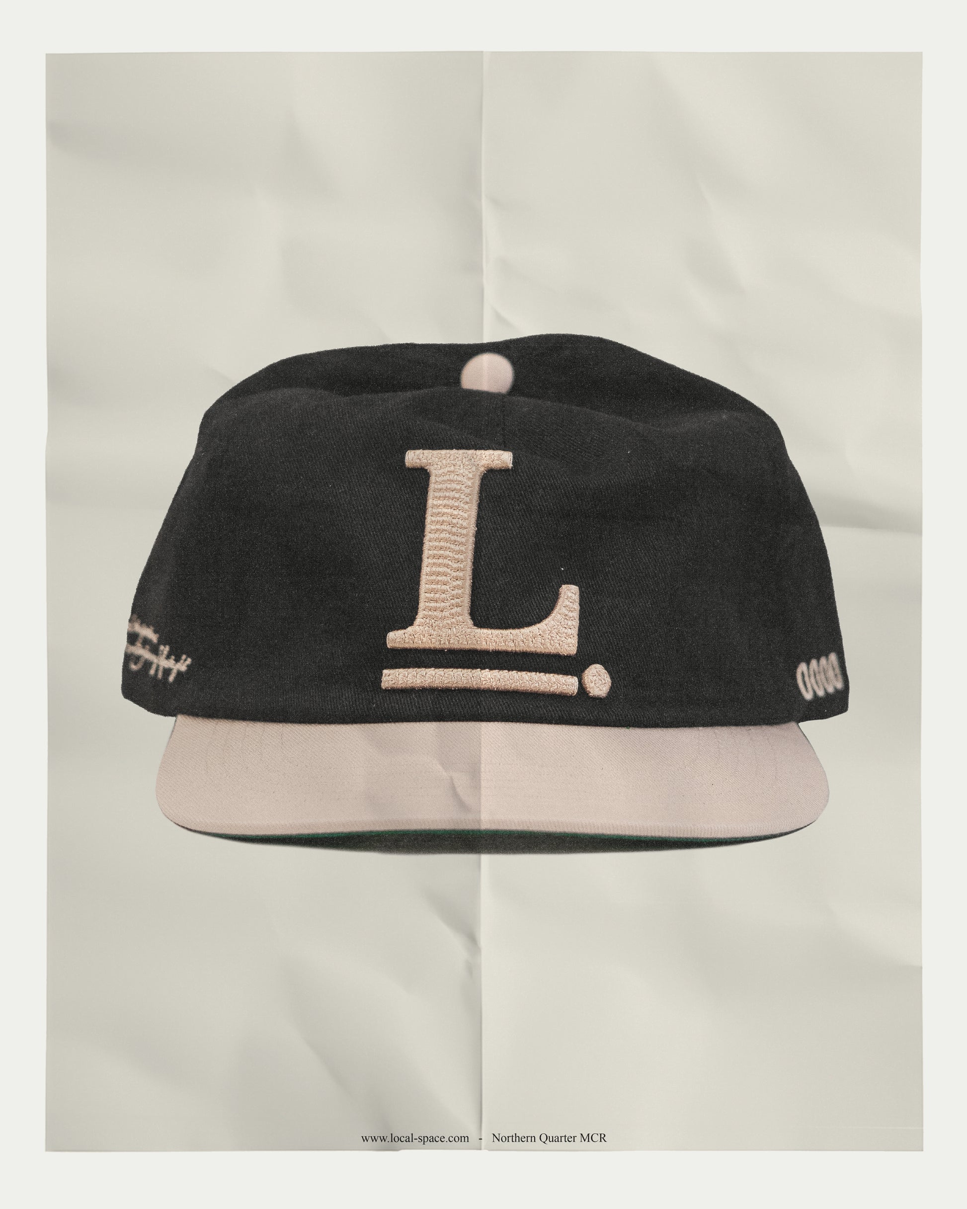 Vintage Inspired Snapback cap with Local Space emblem in 3D chain embroidery on the front, ISSUE 0000 on the left, and LOCAL logo on the rear, showcasing an unstructured crown and a green under brim