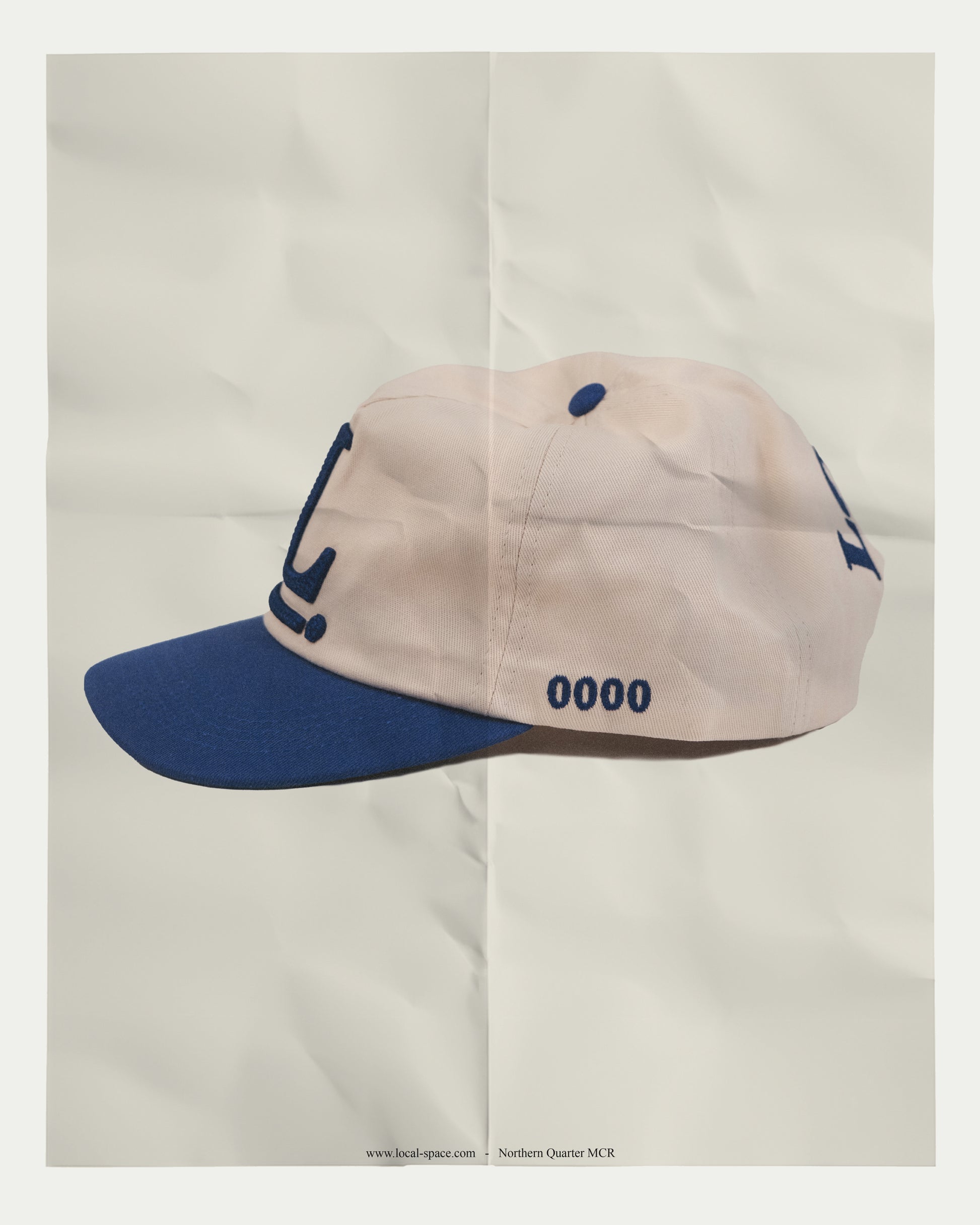Vintage Inspired Snapback cap with Local Space emblem in 3D chain embroidery on the front, ISSUE 0000 on the left, and LOCAL logo on the rear, showcasing an unstructured crown and a green under brim